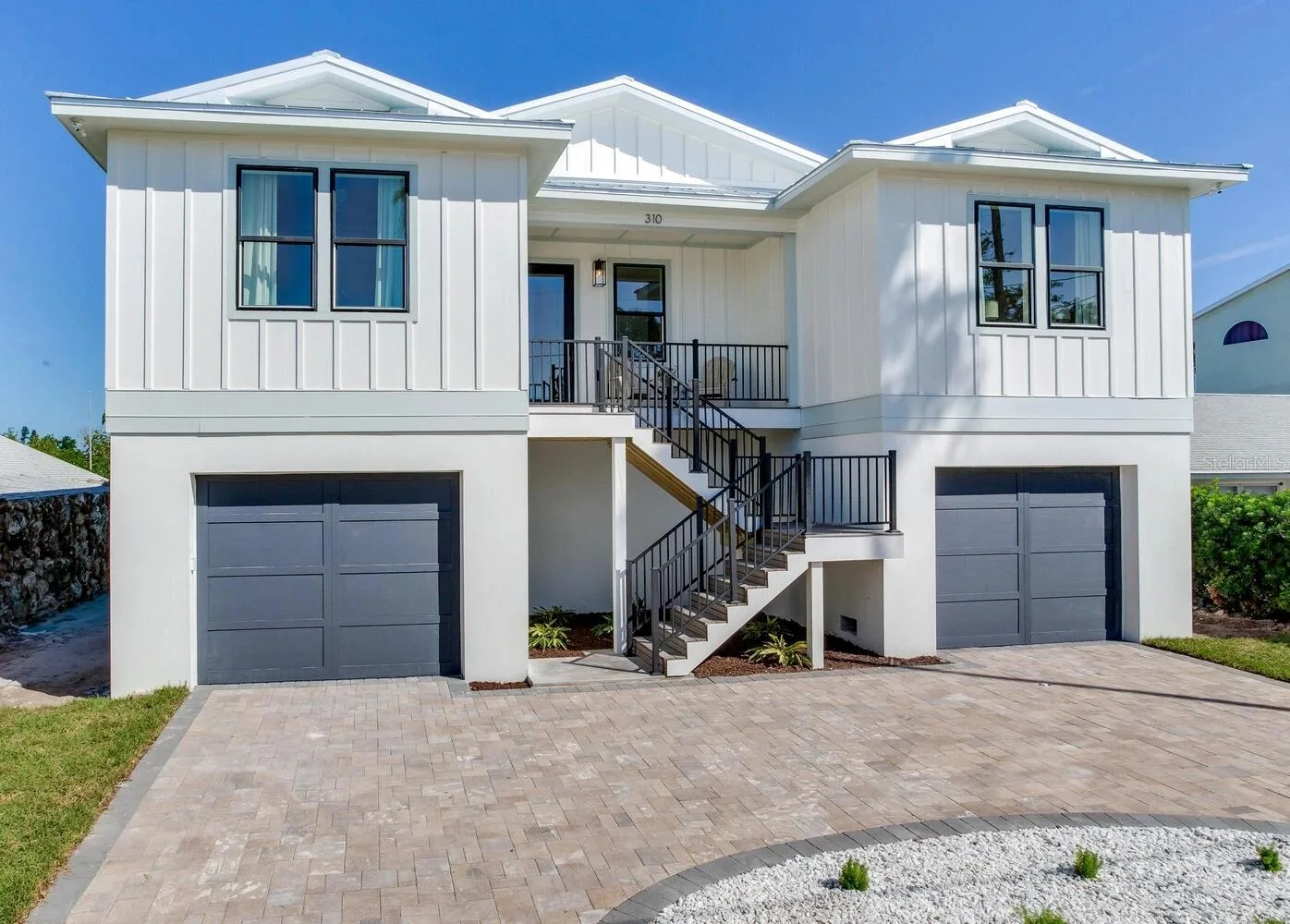 Photos show a completed home in Indian Rocks Beach for illustration purposes only. Actual home, finishes, selections, and features may vary.