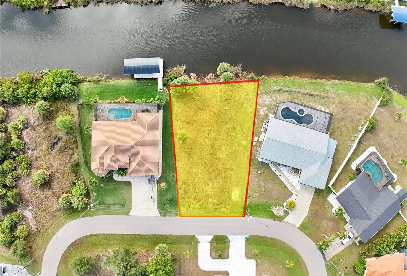 Closer aerial view of cleared canal front lot