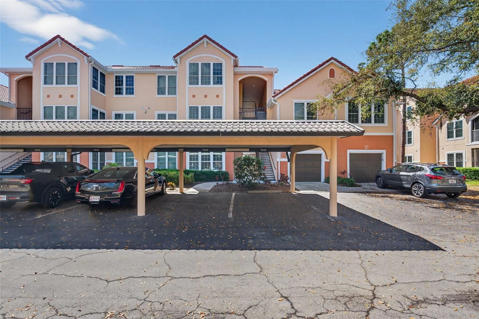 Front exposure of bldg 4138 with carports, detached garages and guest parking available