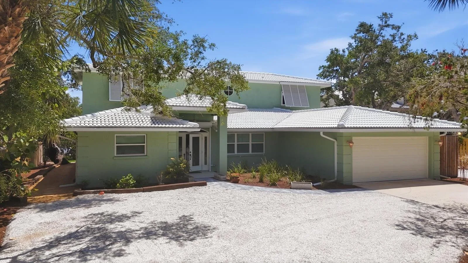 Front of Home features a circular driveway