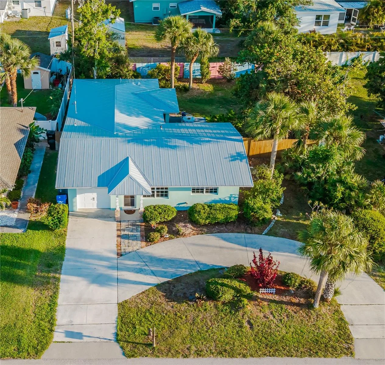 New metal roof. Circular driveway and garage.