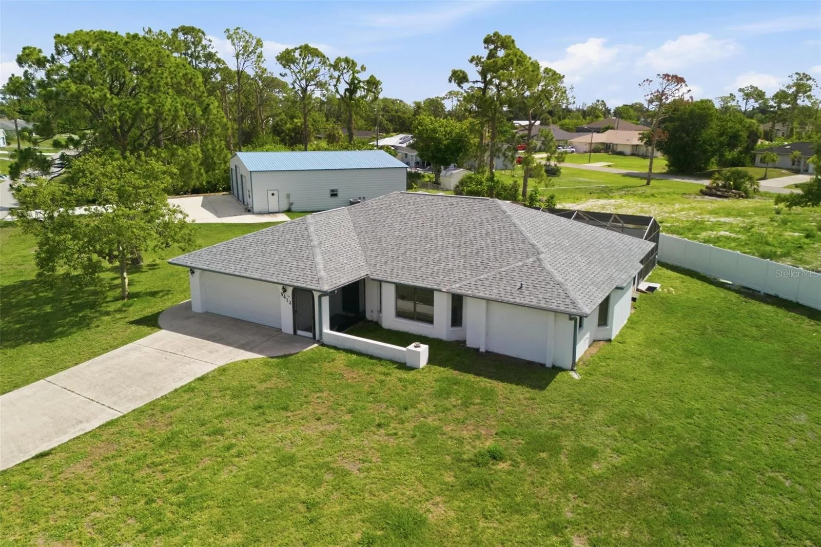 Florida Dream Home Features 3 Bedroom, 2 Bath, 2 Car Garage Pool Home on 3 Lots with a Huge Detached Garage/Metal Building that boost over 2400 sf under air, with separate furnished apartment....