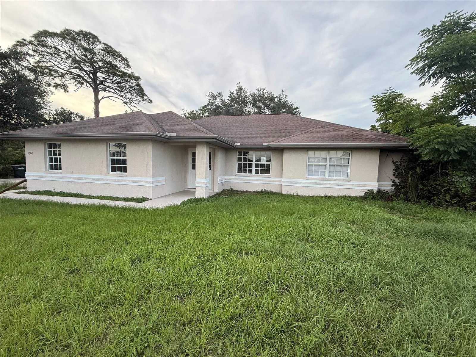 3500 W Price Blvd on a 18,393 SF lot nestled by the MacCaughey Waterway.