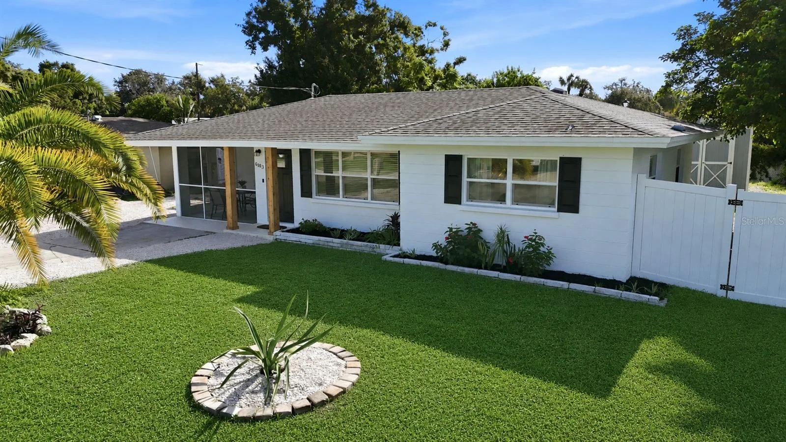 Single-story renovated home with landscaped front yard in Gulf Gate, Sarasota, Florida