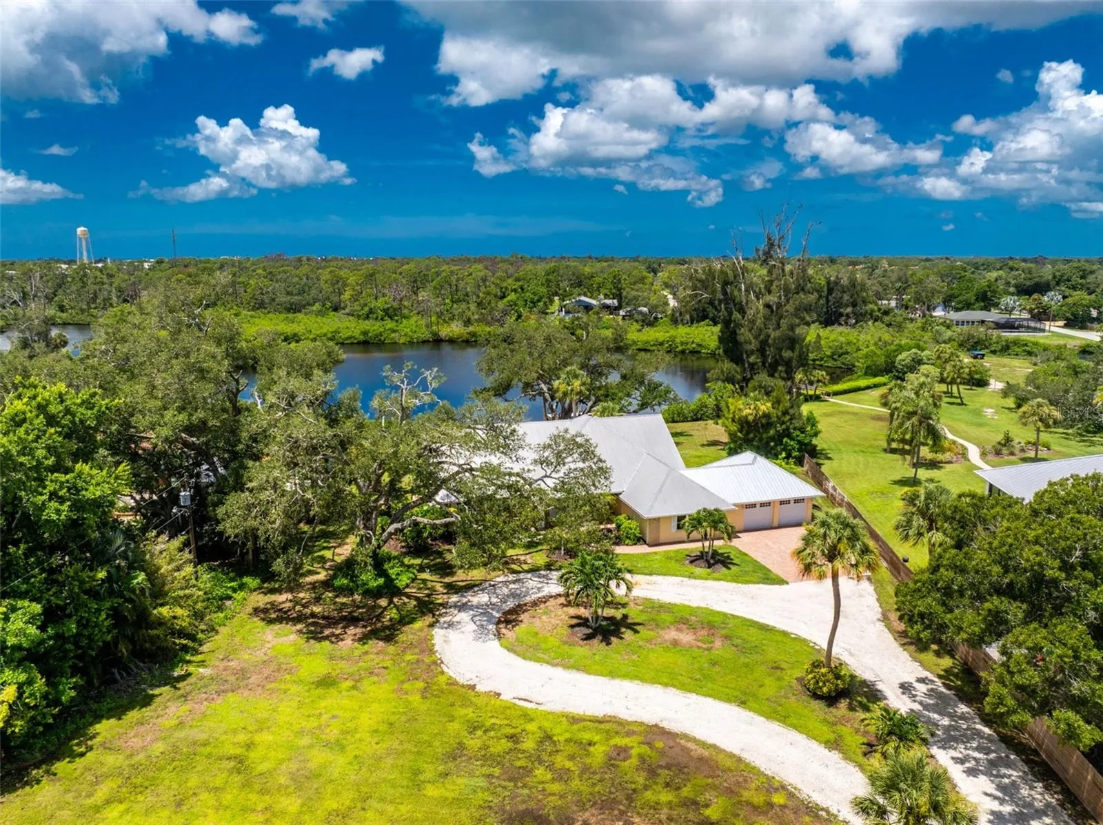 Waterfront home is situated on over an acre, right in Englewood!