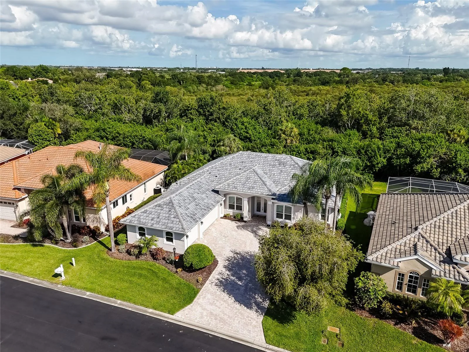 Gated, 2026 tile roof, impact glass, 3 car garage & pvt. mail box.