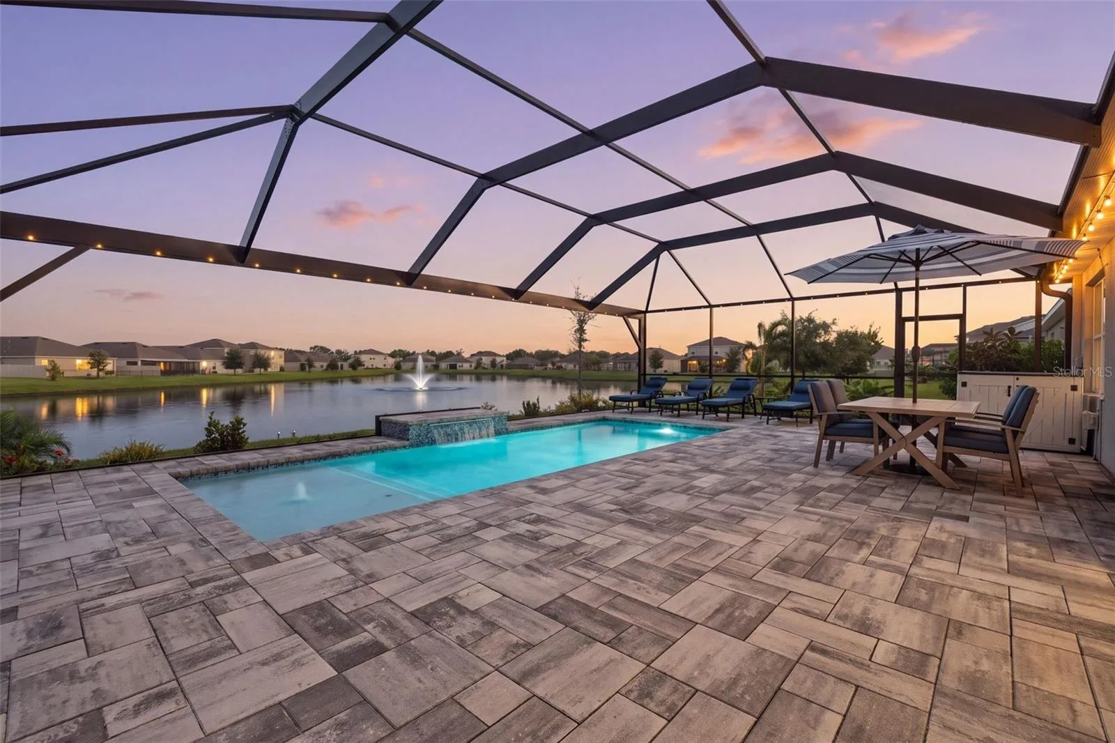 Spectacular lake front setting with south exposure and saltwater pool/spa